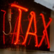 neon sign saying "TAX"