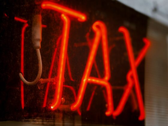 neon sign saying "TAX"